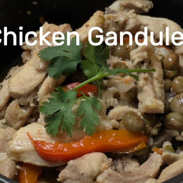 Chicken Gandules recipe served in a bowl.