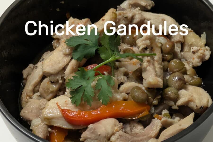 Chicken Gandules recipe served in a bowl.